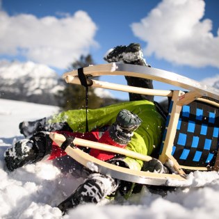 On the toboggan run or simply down the snowy hill - when sledging in the Alpenwelt Karwendel, everyone gets their money's worth!, © Alpenwelt Karwendel | Philipp Gülland