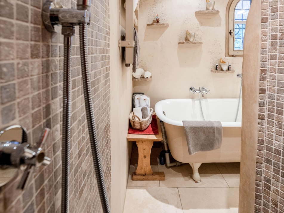 Bathroom with bathtub. sink and toilet.