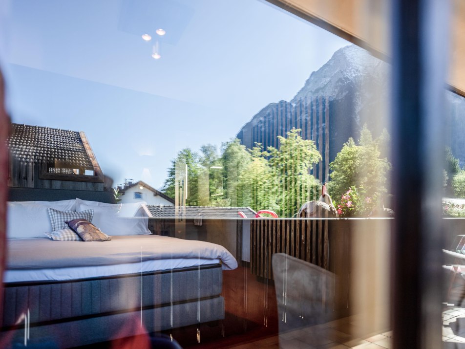 Bedroom with balcony and  mountain view